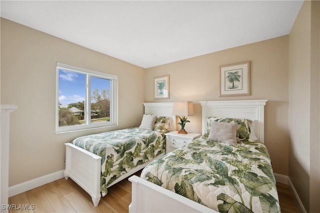 bedroom with light hardwood / wood-style flooring