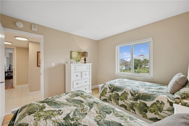 bedroom featuring light tile patterned floors