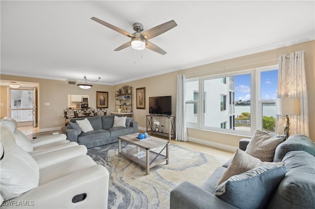 living room featuring ornamental molding, ceiling fan, and light hardwood / wood-style floors