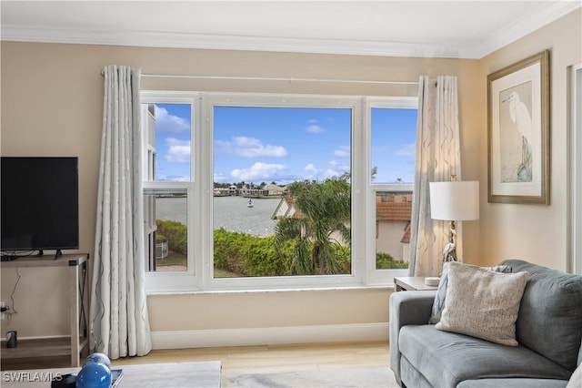 interior space featuring ornamental molding and a water view