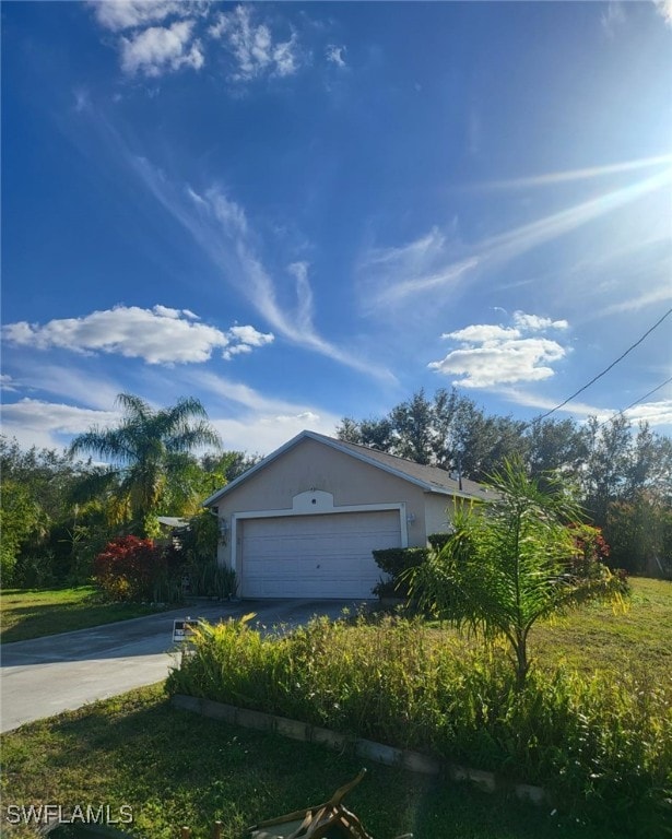 view of side of home with a garage