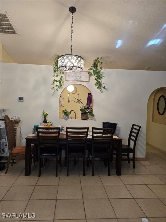 dining area with tile patterned flooring