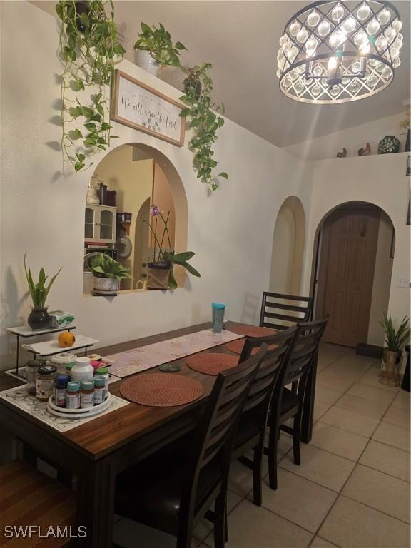 dining area featuring tile patterned flooring