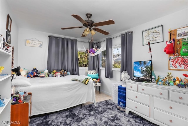 carpeted bedroom featuring ceiling fan