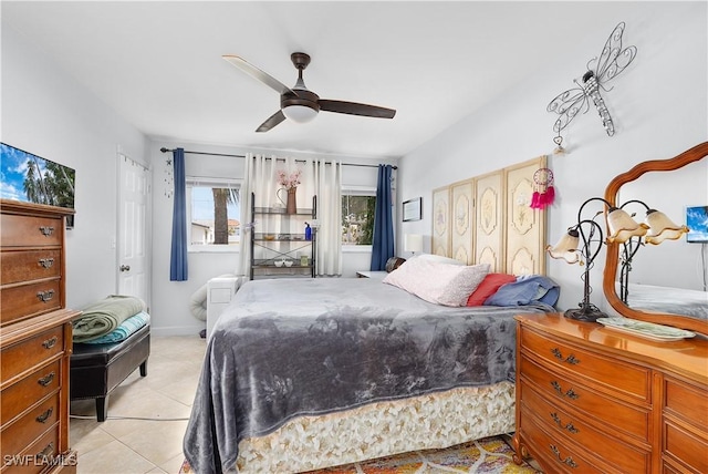 tiled bedroom with ceiling fan