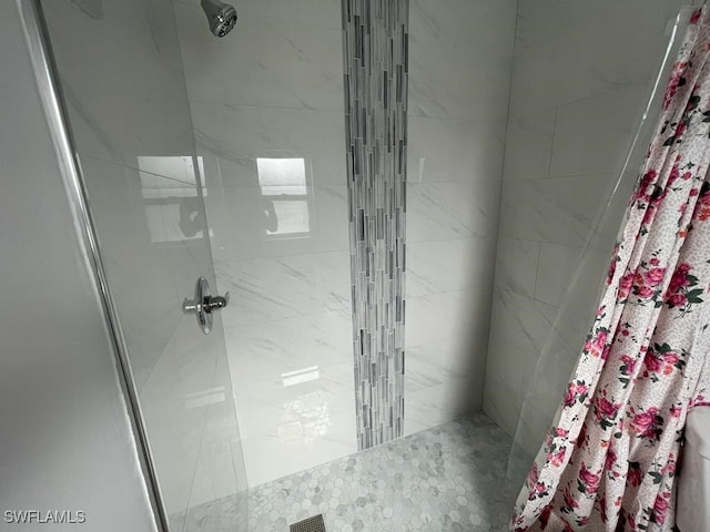 bathroom with a shower with shower curtain