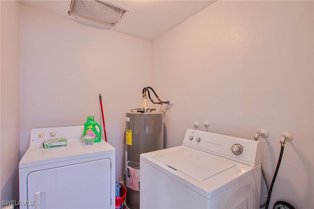 washroom featuring separate washer and dryer and water heater