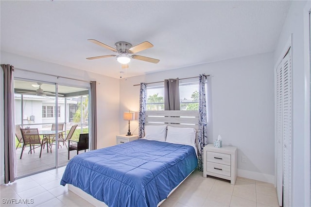 tiled bedroom featuring ceiling fan