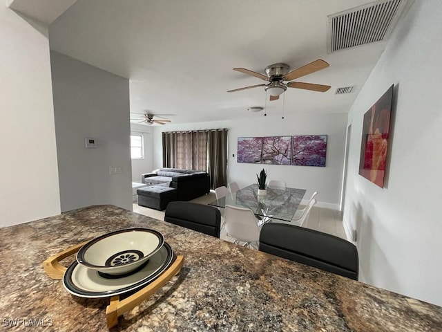 dining space featuring ceiling fan