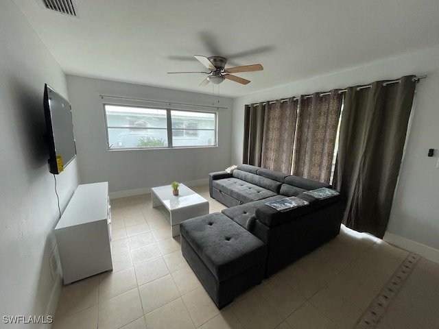 living room featuring light tile patterned floors and ceiling fan