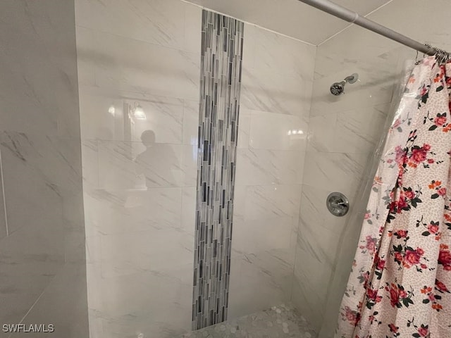 bathroom featuring a shower with curtain