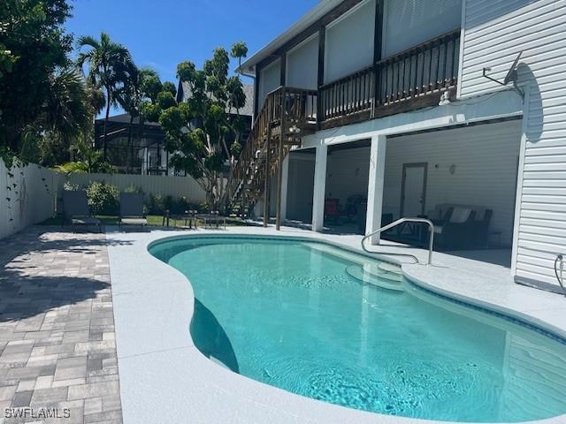 view of pool featuring a lanai and a patio