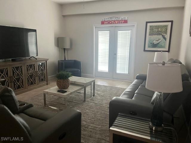 living room featuring light tile patterned floors and french doors