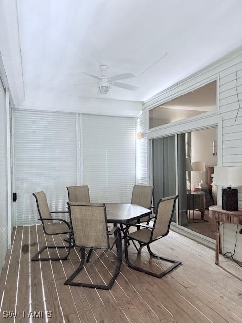 dining room featuring wood-type flooring and ceiling fan