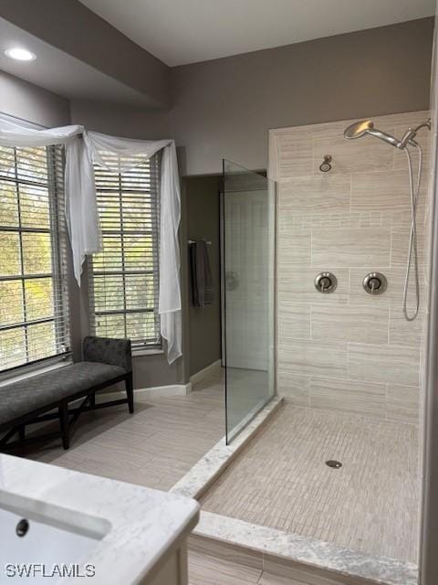 bathroom with a tile shower