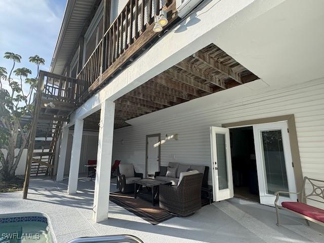 view of patio / terrace with an outdoor living space and a balcony