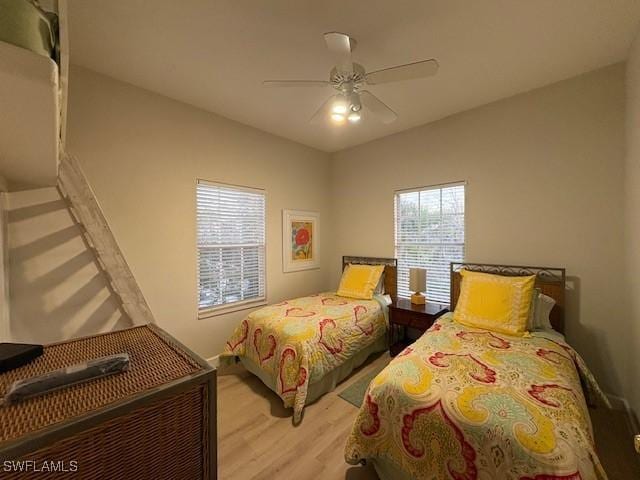 bedroom featuring light hardwood / wood-style floors and ceiling fan