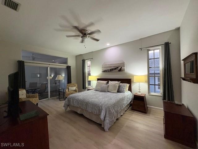 bedroom with ceiling fan and light hardwood / wood-style flooring