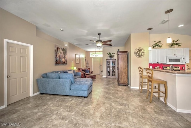 living room with sink and ceiling fan