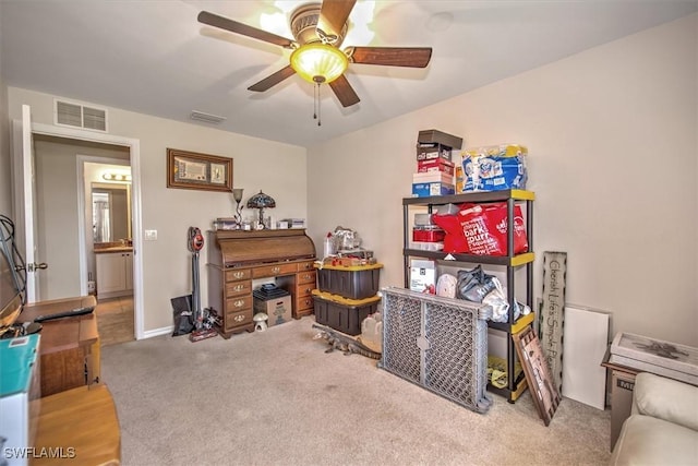 interior space featuring carpet flooring and ceiling fan