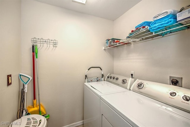 laundry room featuring washing machine and dryer