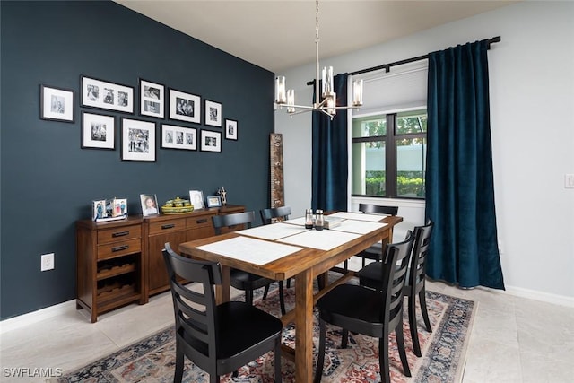 tiled dining space featuring a notable chandelier