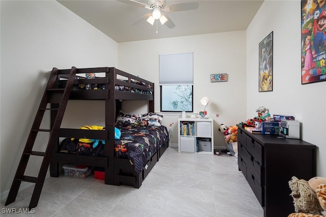 tiled bedroom featuring ceiling fan