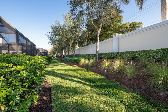 view of yard with a lanai