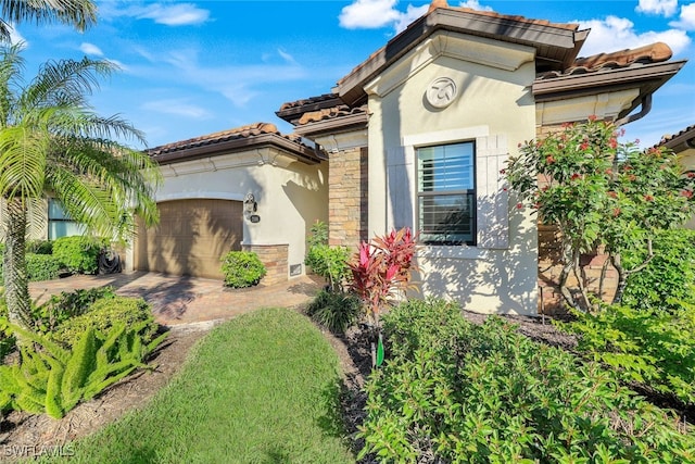 view of front of home with a garage