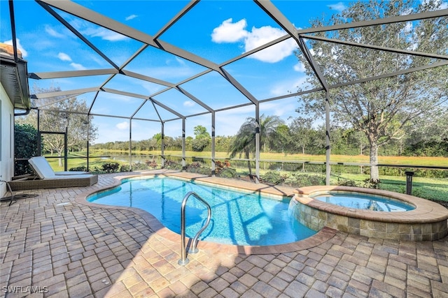 view of pool featuring a lanai, a patio, and an in ground hot tub