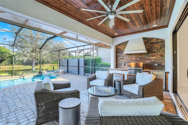 view of patio featuring exterior kitchen, outdoor lounge area, and a grill