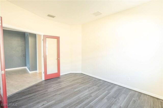 empty room with wood-type flooring