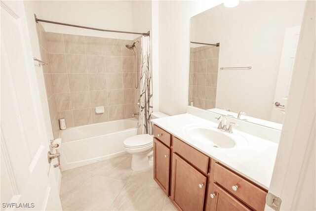 full bathroom with vanity, shower / bath combination with curtain, tile patterned floors, and toilet