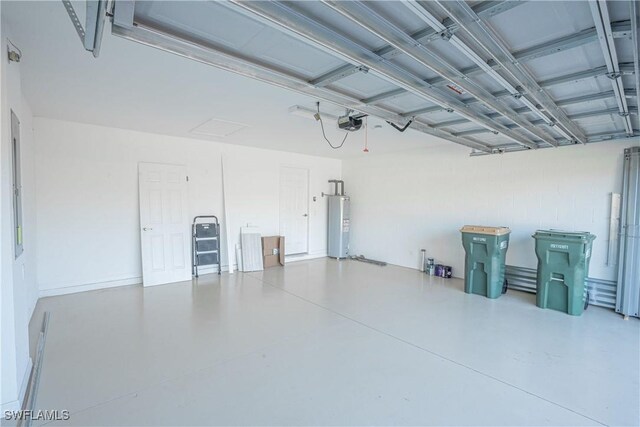 garage with a garage door opener and water heater