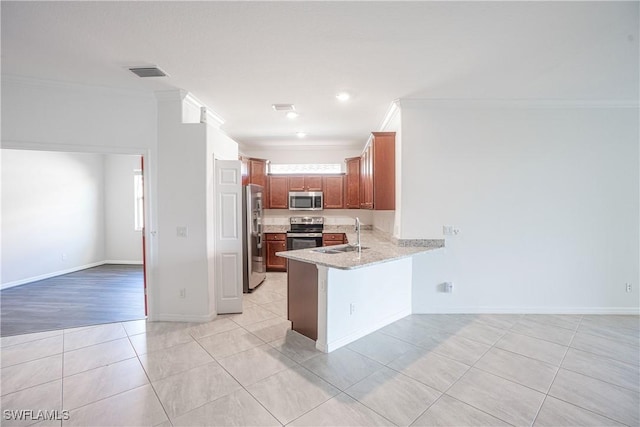 kitchen featuring sink, crown molding, light tile patterned floors, stainless steel appliances, and kitchen peninsula