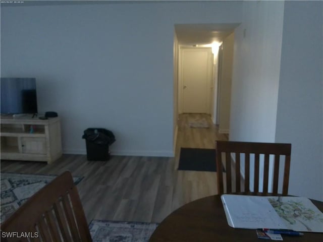 dining room with wood-type flooring