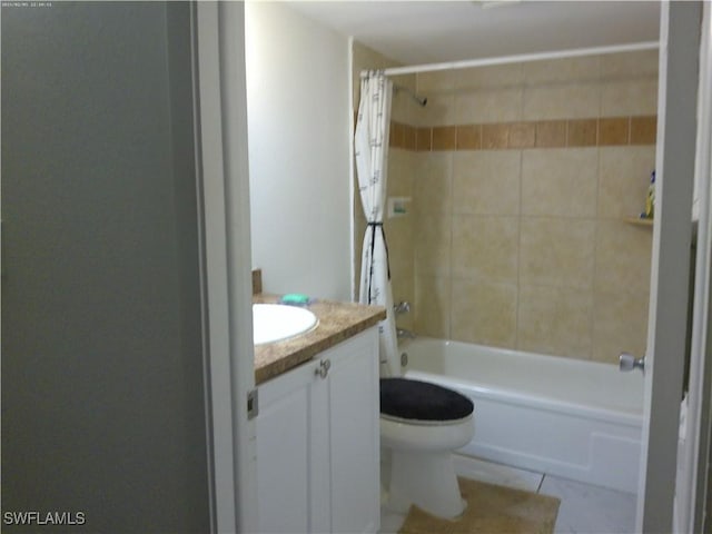 full bathroom featuring tile patterned flooring, vanity, shower / tub combo, and toilet