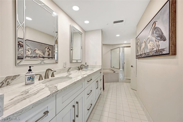 bathroom featuring tile patterned floors, independent shower and bath, and vanity