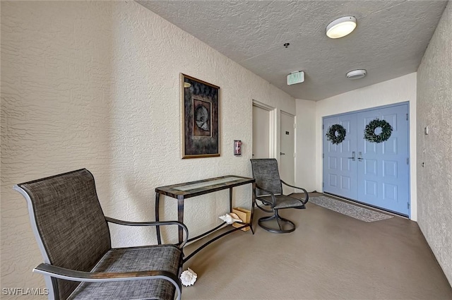 sitting room with a textured ceiling