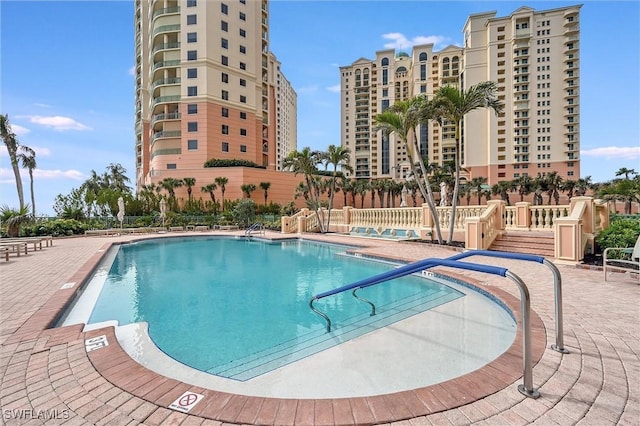 view of swimming pool with a patio area