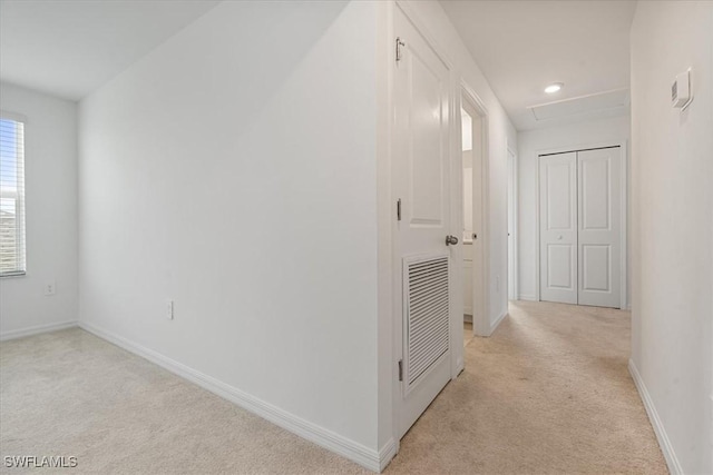 hallway with light carpet