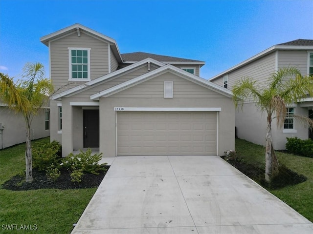 view of front of property with a garage