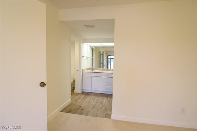 hallway featuring light hardwood / wood-style flooring