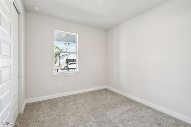 unfurnished room with carpet floors