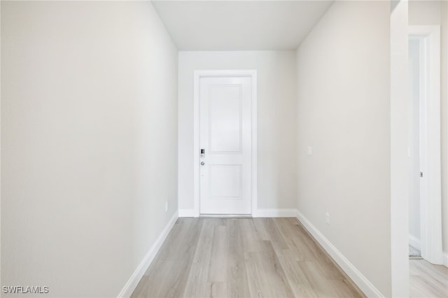 corridor featuring light hardwood / wood-style flooring