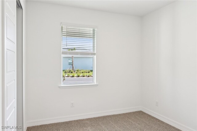 16672 Expedition Ct, Punta Gorda, FL 33982 - carpeted empty room with baseboards