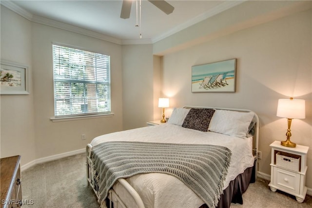 carpeted bedroom featuring ceiling fan and ornamental molding