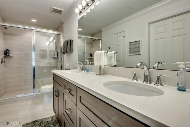 bathroom with vanity, walk in shower, crown molding, and toilet