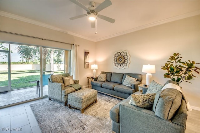 living room featuring crown molding and ceiling fan