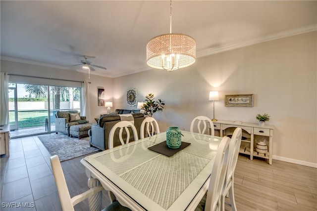 dining room featuring crown molding, ceiling fan with notable chandelier, and light hardwood / wood-style floors